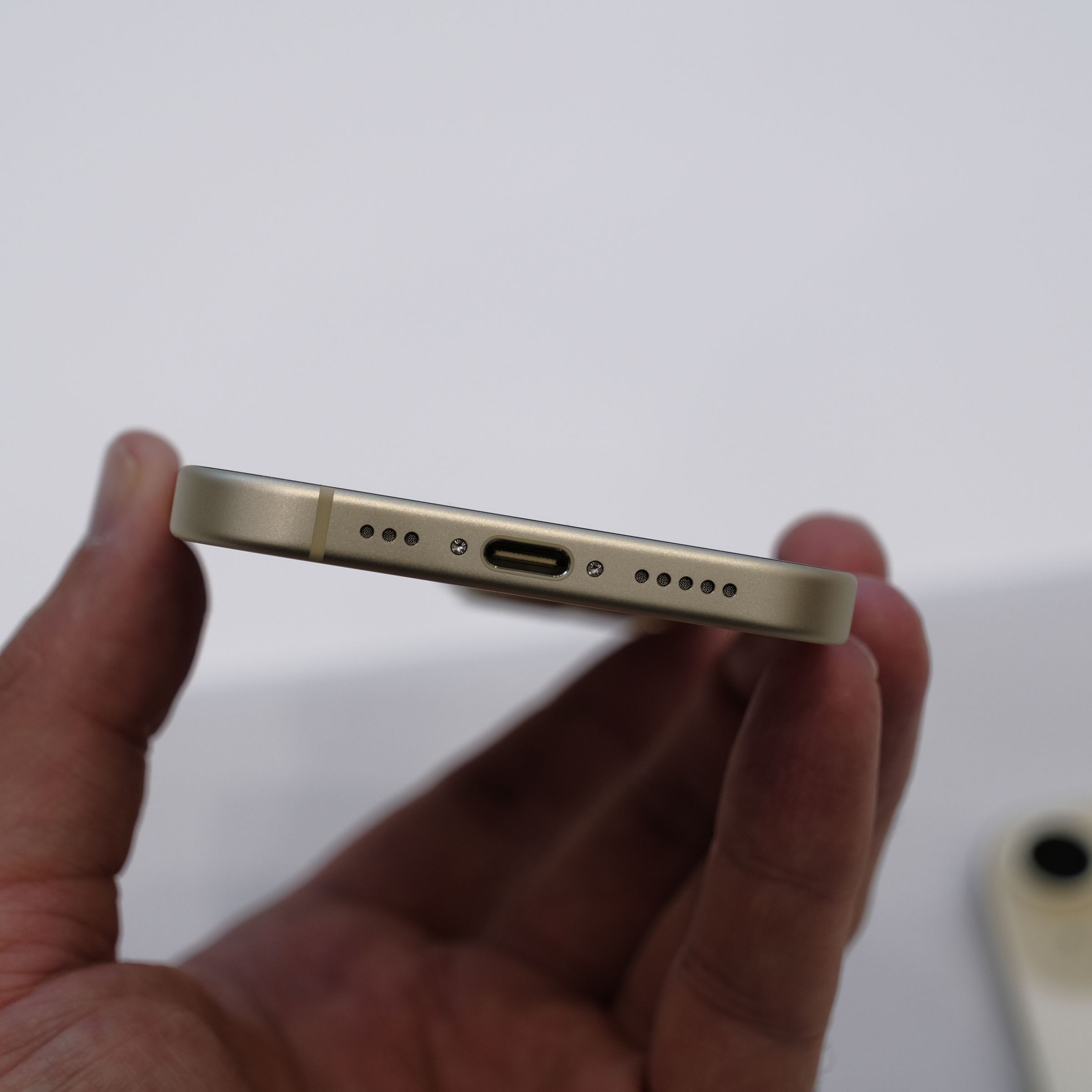 A picture of the USB-C port on the bottom of an iPhone 15