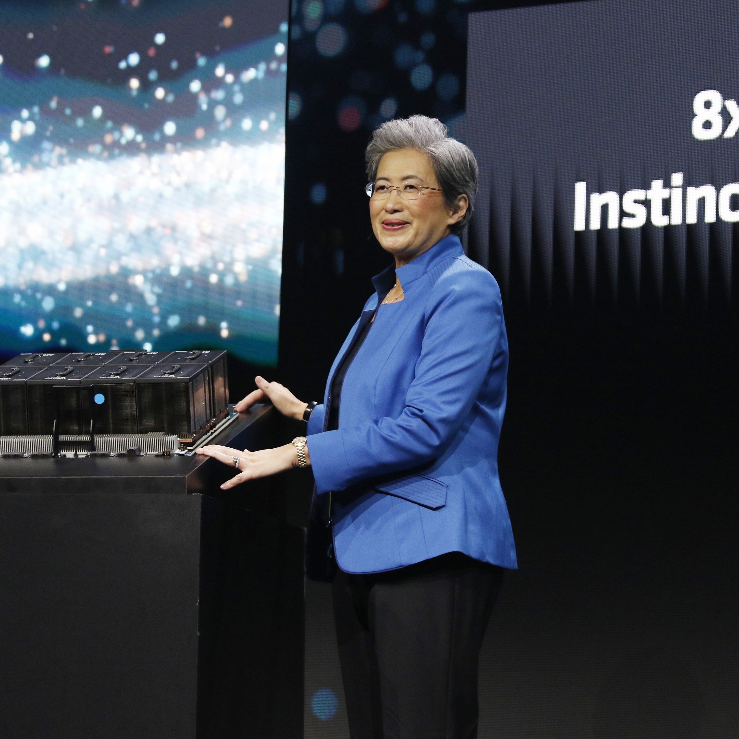 Lisa Su onstage with MI300X processors
